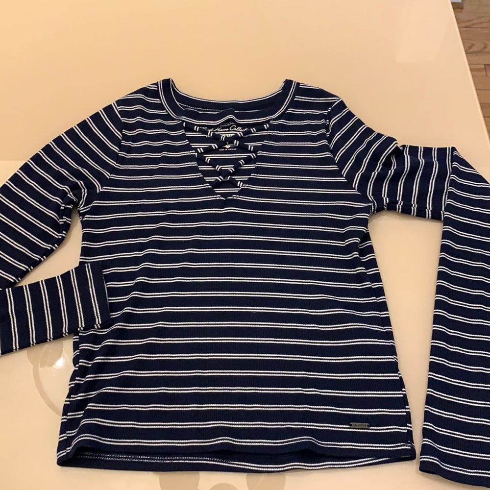 black & white striped shirt with criss cross neck